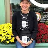 woman with a coffee and flowers